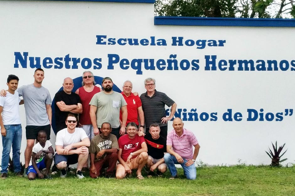 Volunteers in front of a bulding